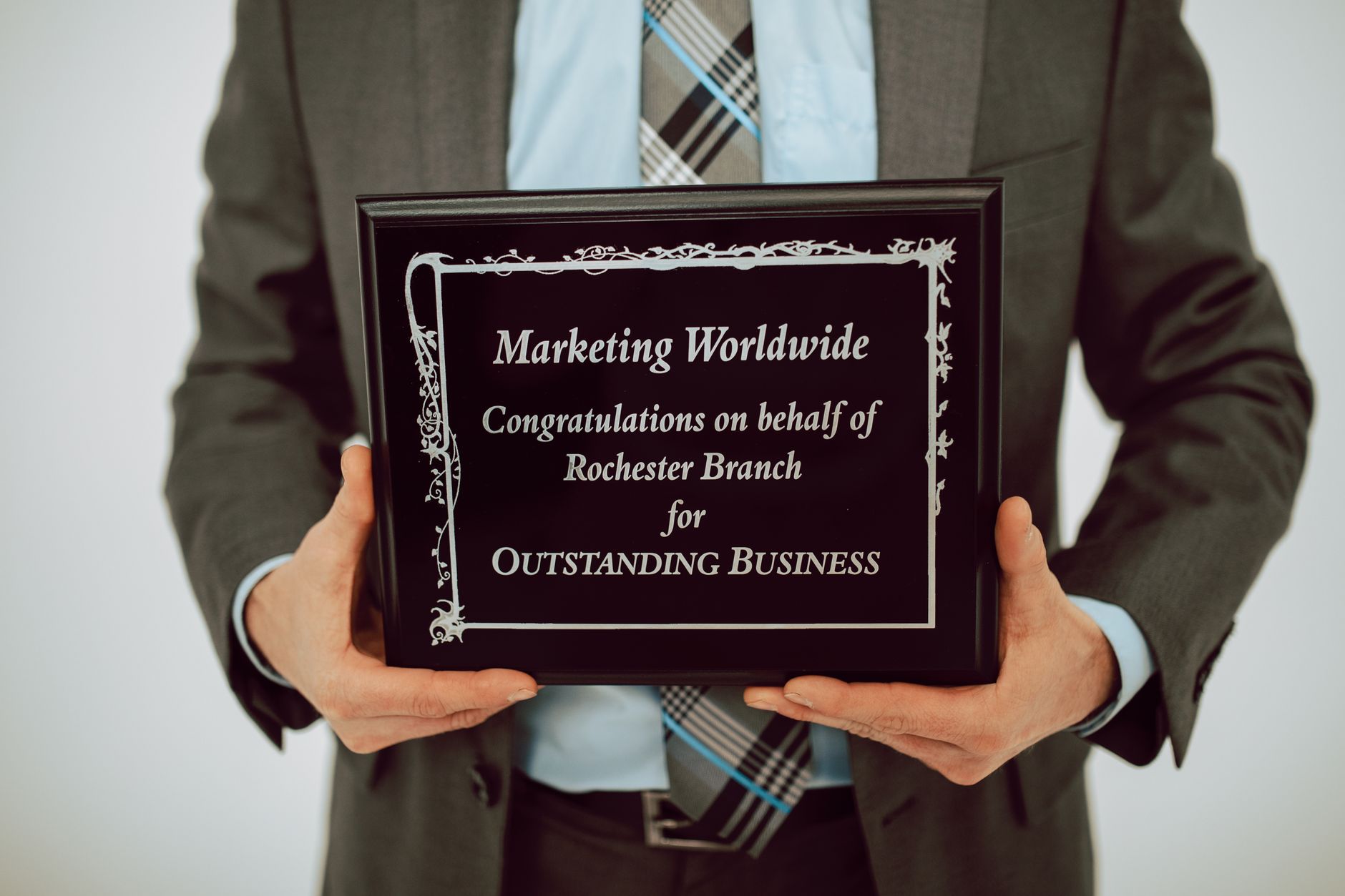 a person holding a plaque